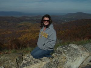 Krist Woodward, Stormwater Admin, enjoying a mountaintop