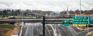 Colorado highway with signs and traffic. CDOT is using 2NFORM stormwater compliance software to manage stormwater on highways 2048 x 800