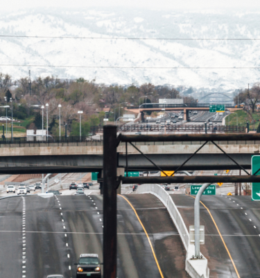 Colorado highway with signs and traffic 2048 x 800